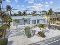 Single-Gathering home with metal roof and landscaped yard at 2740 E Vina Del Mar Blvd, St Pete Beach, FL 33706