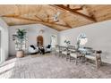 Sunlit dining room with wood ceiling beams at 2740 E Vina Del Mar Blvd, St Pete Beach, FL 33706