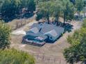 Aerial view of home with pool and screened enclosure at 35351 Nina Sue Ln, Dade City, FL 33523