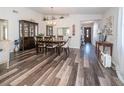 Elegant dining room with hardwood floors and a large dining table at 37443 Blueberry Ct, Zephyrhills, FL 33542