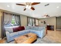 Bright living room with a comfy sectional sofa and tile floors at 5211 2Nd S Ave, St Petersburg, FL 33707