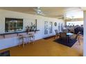 Covered patio with outdoor kitchen and dining area at 72 Norman St, Port Charlotte, FL 33954