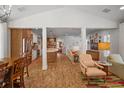 Bright and airy living room features hardwood floors and open concept design at 728 Wood St, Dunedin, FL 34698