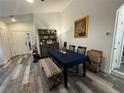 Dining area featuring a table, bench, and wood hutch at 8434 Hawbuck St, Trinity, FL 34655