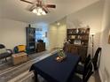 Open living room and dining area with wood-look flooring at 8434 Hawbuck St, Trinity, FL 34655