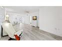 Bright living room with light grey vinyl flooring and recessed lighting at 845 Maple Ct # 107, Dunedin, FL 34698