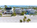 Aerial view of beach houses and a beautiful beach at 1205 Gulf Way, St Pete Beach, FL 33706