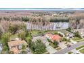 Aerial view of house and neighborhood, showcasing lake view at 18817 Chaville Rd, Lutz, FL 33558