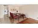 Dining room featuring a modern table set, elegant lighting, and neutral color palette at 220 Belleview Blvd # 811, Belleair, FL 33756