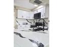 Modern kitchen features white cabinets and quartz countertops at 2910 W Burke St, Tampa, FL 33614