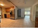 Kitchen with stainless steel refrigerator and wood cabinets at 3090 Arrowhead Rd, Venice, FL 34293