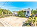 Front view of a charming bungalow with parking and landscaping at 3147 Prescott N St, St Petersburg, FL 33713