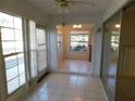 Bright sunroom with tile floors and multiple windows at 4708 Lacrosse Ct, New Port Richey, FL 34655