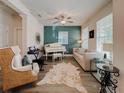 Bright living room with piano and comfy seating at 5709 Camila Song Ln, Tampa, FL 33625