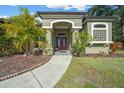 House entrance with double doors and walkway at 628 Erin Way, Brooksville, FL 34601