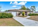 Cute ranch home with a large yard and a detached garage at 7095 17Th N Way, St Petersburg, FL 33702