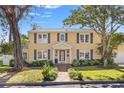 Charming two-story house with a brick walkway and well-manicured lawn at 740 13Th N Ave, St Petersburg, FL 33701