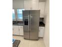 Modern kitchen features stainless steel refrigerator at 840 Tennyson Mill Cir, Tampa, FL 33619