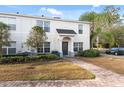 Clean lines and a welcoming front entrance enhance this two-story townhome at 9626 Charlesberg Dr, Tampa, FL 33635