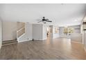 Spacious living room features gray walls, wood-look tile floors, and a ceiling fan at 9626 Charlesberg Dr, Tampa, FL 33635