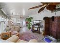 Sunroom with tiled floor, ceiling fan, and ample natural light at 9790 66Th N St # 130, Pinellas Park, FL 33782