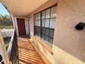 Private balcony with tile flooring and exterior door at 21026 Voyager Blvd # 6, Land O Lakes, FL 34638