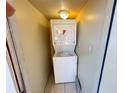 Stackable washer and dryer in a compact closet at 21026 Voyager Blvd # 6, Land O Lakes, FL 34638