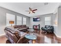 Spacious living room with hardwood floors and a ceiling fan at 10409 Waterstone Dr, Riverview, FL 33578