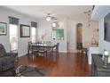 Dining area with hardwood floors and an adjacent kitchen at 1922 Echo Pond Pl, Wesley Chapel, FL 33543