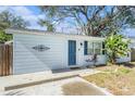 Newly renovated light blue house with a neat front yard at 3612 Phillips St, Tampa, FL 33619
