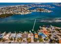 Aerial view of waterfront home with private boat dock at 366 La Hacienda Dr, Indian Rocks Beach, FL 33785