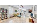 Open living area with tile floors, sofa, and built-in shelving at 3818 Cat Mint St, Tampa, FL 33619