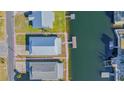 Aerial view of single-story home with water access at 4024 Centavo Ct, Hernando Beach, FL 34607