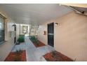 Private condo entrance with covered walkway and secure entry door at 4725 Christa Ct # 331, Tampa, FL 33614