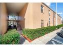 Condo building exterior with a well-maintained lawn and convenient handicap access at 4725 Christa Ct # 331, Tampa, FL 33614