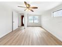 Bright living room featuring hardwood floors and ceiling fan at 8719 92Nd Ter, Seminole, FL 33777