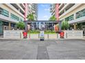 Building entrance with modern glass structure and surrounding businesses at 1208 E Kennedy Blvd # 729, Tampa, FL 33602