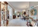 Bright and spacious entryway with tile floors and views into the dining and living areas at 205 Silver Falls Dr, Apollo Beach, FL 33572