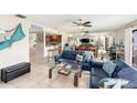 Bright living room with comfy seating and ocean views at 2406 Gulf Blvd # 204, Indian Rocks Beach, FL 33785