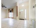 Bright and spacious entryway with tile flooring and an arched doorway at 3123 W Rio Vista Ave, Tampa, FL 33614