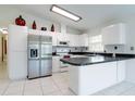 Modern kitchen with stainless steel appliances and an island at 3123 W Rio Vista Ave, Tampa, FL 33614