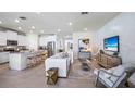 Modern kitchen with stainless steel appliances and an island at 32443 Osprey Peak Way, San Antonio, FL 33576