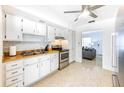 Bright kitchen featuring white cabinets and modern appliances at 6105 Antrim St, New Port Richey, FL 34653