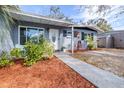 Attractive front yard with walkway, landscaping, and a charming entrance at 9465 50Th N Way, Pinellas Park, FL 33782