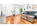 Living room featuring hardwood floors, large window, and an entryway at 9465 50Th N Way, Pinellas Park, FL 33782