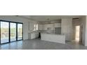 Modern kitchen with white cabinets and island at 10658 Rainsville St, Port Charlotte, FL 33981