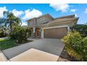 Two-story house with a brown garage door at 1317 Lorea Ln, Brandon, FL 33511