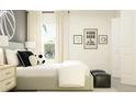 Bright bedroom featuring a light gray bed and neutral decor at 15233 Rainbow Quartz St, Wimauma, FL 33598