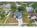 House with a lake view and community amenities nearby at 1628 Baker Rd, Lutz, FL 33559