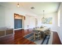 Bright dining room with hardwood floors and a wooden table at 18992 Roseate Dr, Lutz, FL 33558